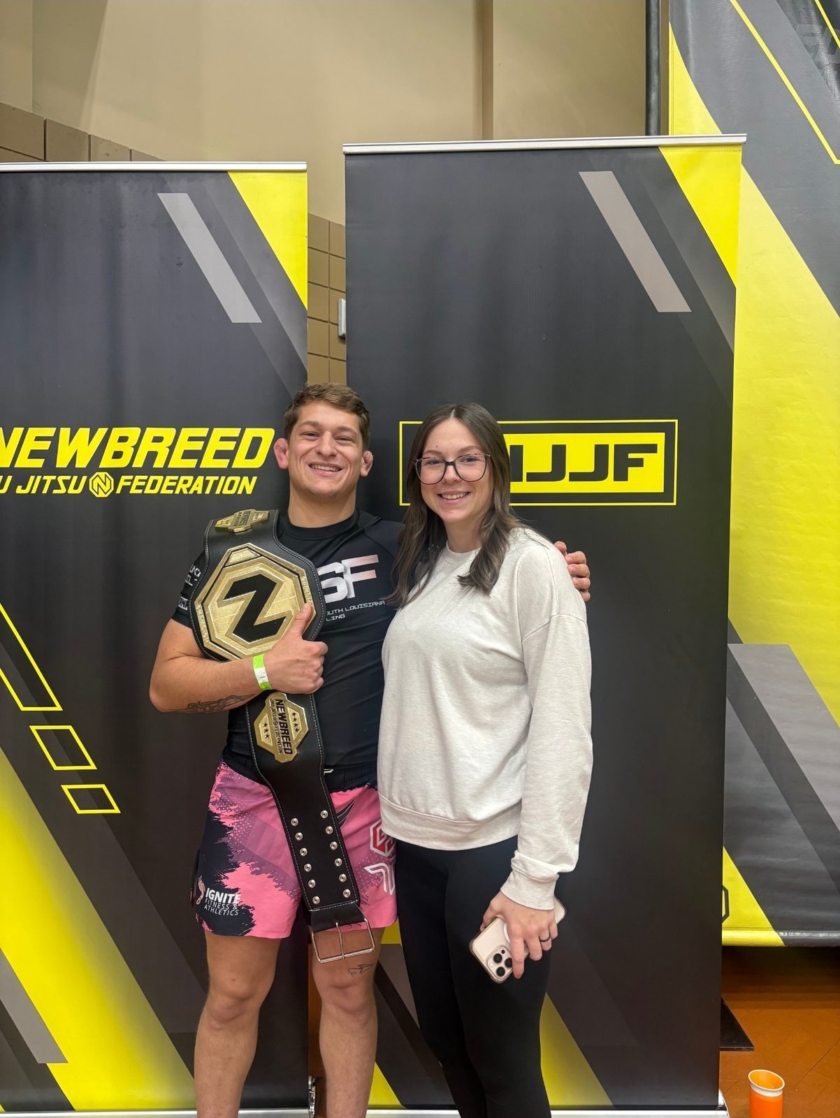 Drake with a championship belt and his wife