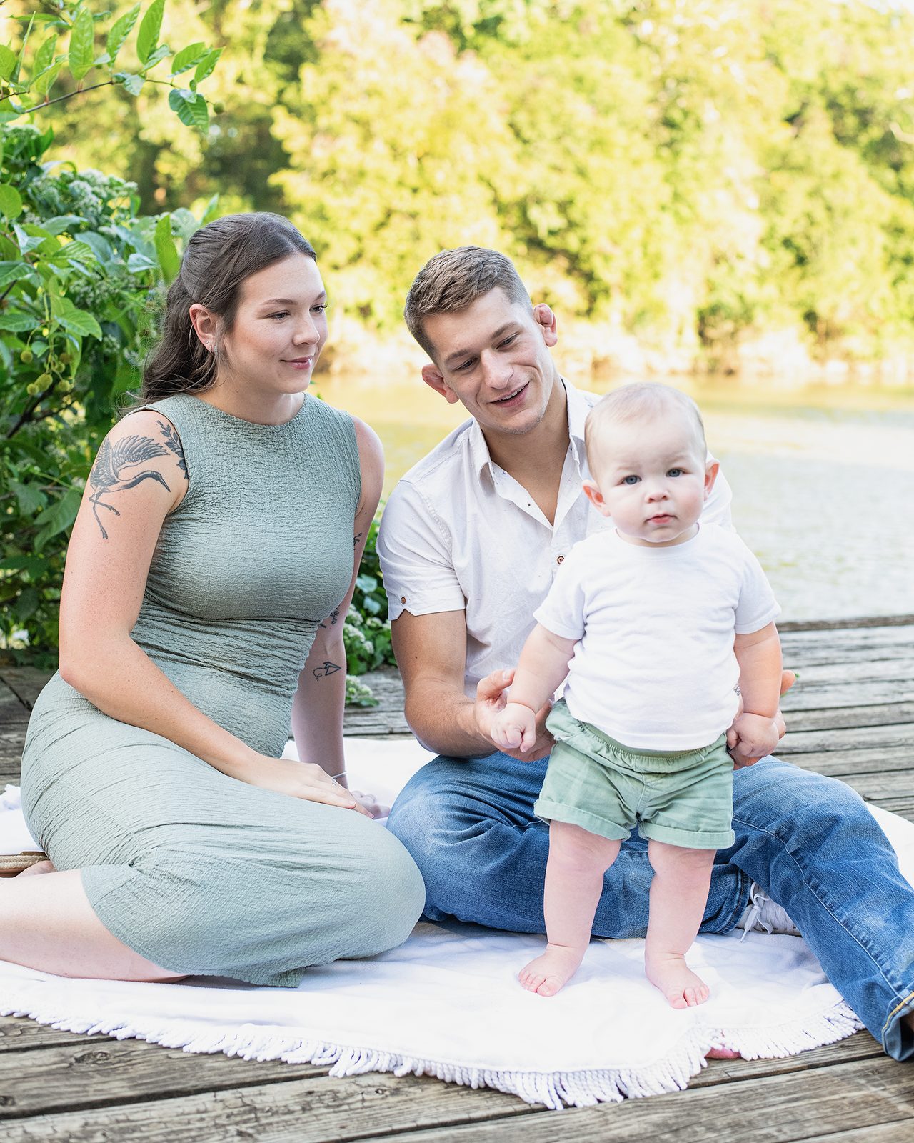 Drake with his wife and son at the water