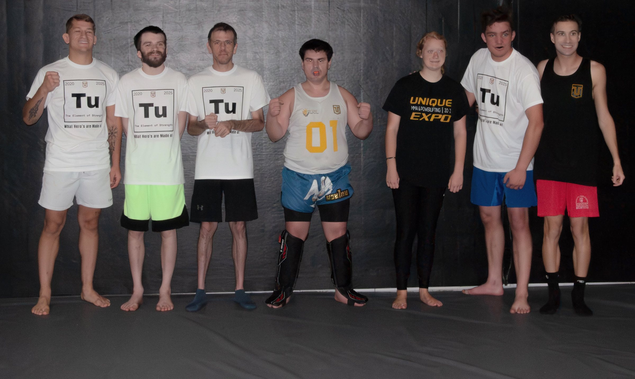 The MMA class lined up on the mat in their gear